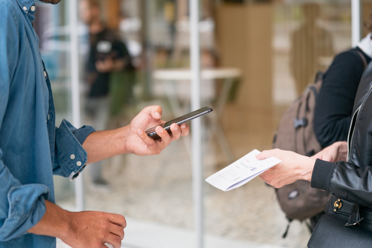 A guest scanning a QR code with a smartphone camera