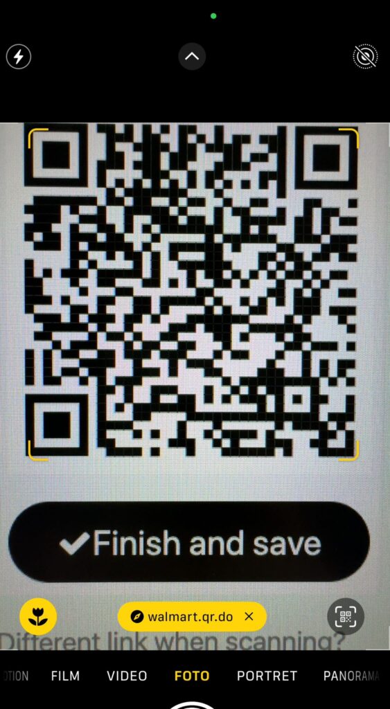 Screenshot on the Iphone camera app, when a QR code is being scanned. A yellow pop-up appears in the bottom of the screen with the text "walmart.qr.do".