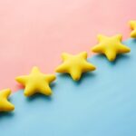 5 yellow stars on a pink-blue background.