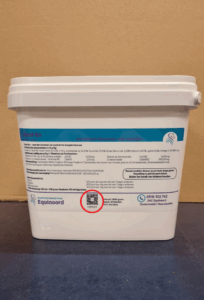 Image of a box of horse feed, where a tiny QR code is visible on the packaging.